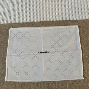 CHANEL Authentic White Canvas Dust
Bag with Zipper